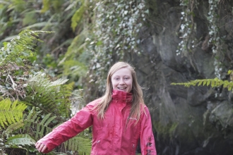 Molly stands in a stream