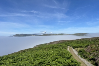 A view of the Isle of Man from the Calf of Man during a temperature inversion.