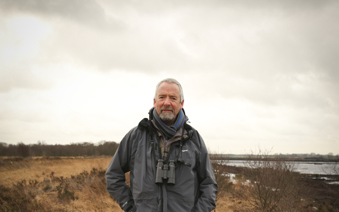 Dave stands on a nature reserve